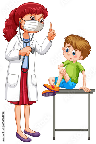Doctor examining little boy