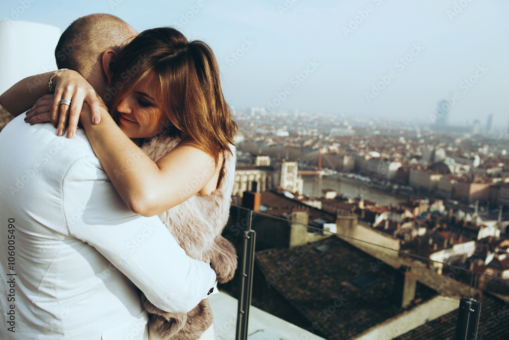 Fototapeta premium wonderful rich bride and groom hugging on the terrace on the bac