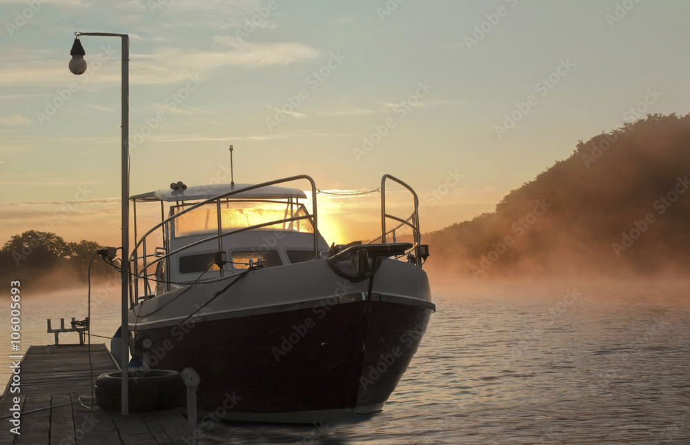 white yacht near surf in the fog during sunset.Dnister white yacht near surf in the fog during sunset.Dnister