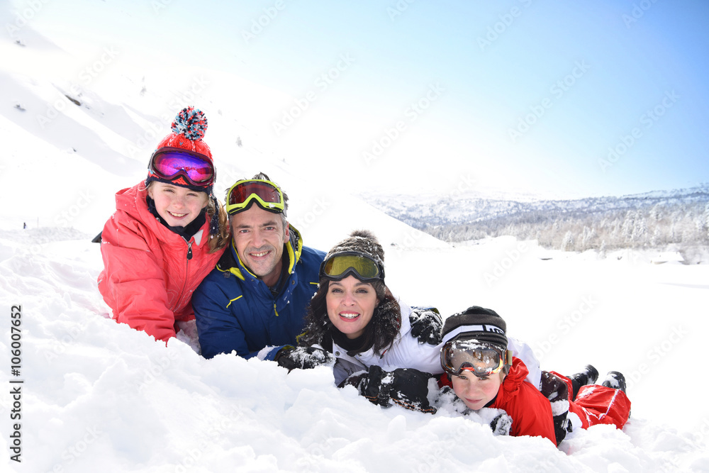 Portrait of family having fun in the snow