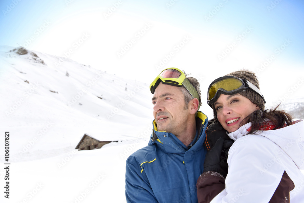 Portrait of middle-aged couple at ski resort