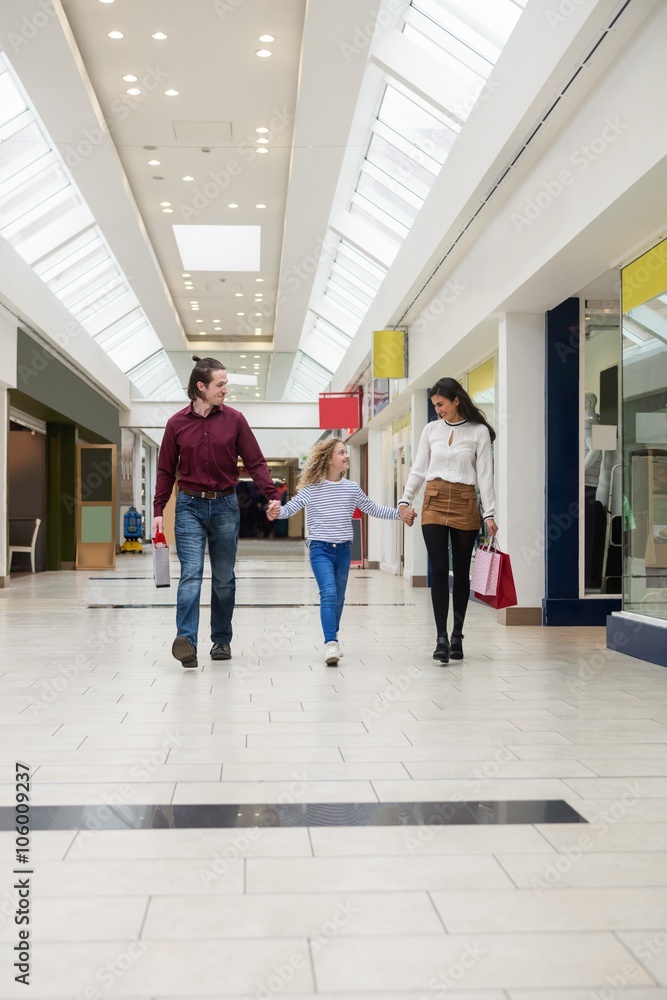 Happy family walking with shopping bags Happy family walking with shopping bags