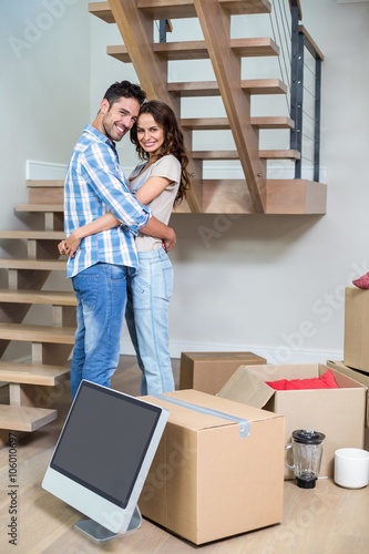 Portrait of cheerful couple hugging