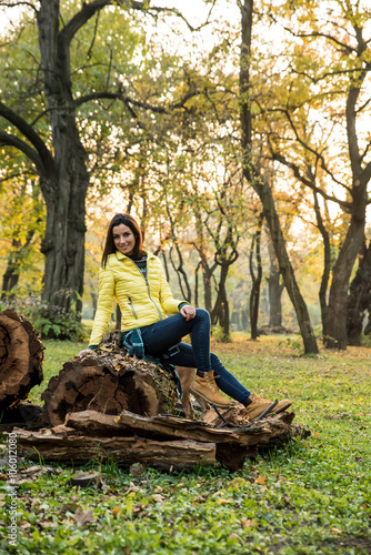 Woman enjoying the autumn in the forest 