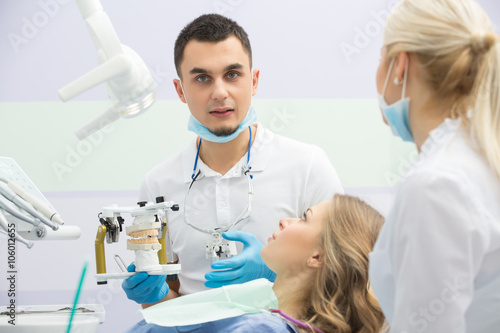 Modern dental clinic  young dentist working