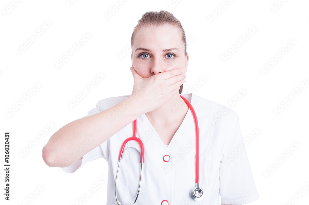 Beautiful woman doctor covering her mouth with palm Beautiful woman doctor covering her mouth with palm