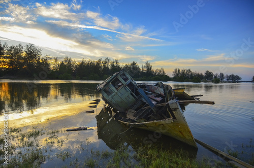 Old abandoned fisherman boat on the riverside © nelzajamal
