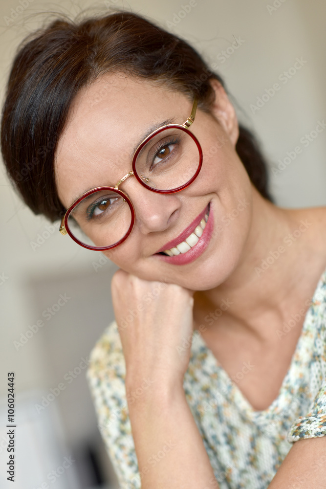 Portrait of smiling middle-aged woman with eyeglasses Portrait of smiling middle-aged woman with eyeglasses