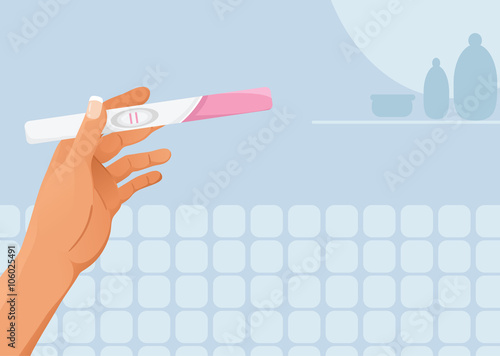 Hand with pregnancy test