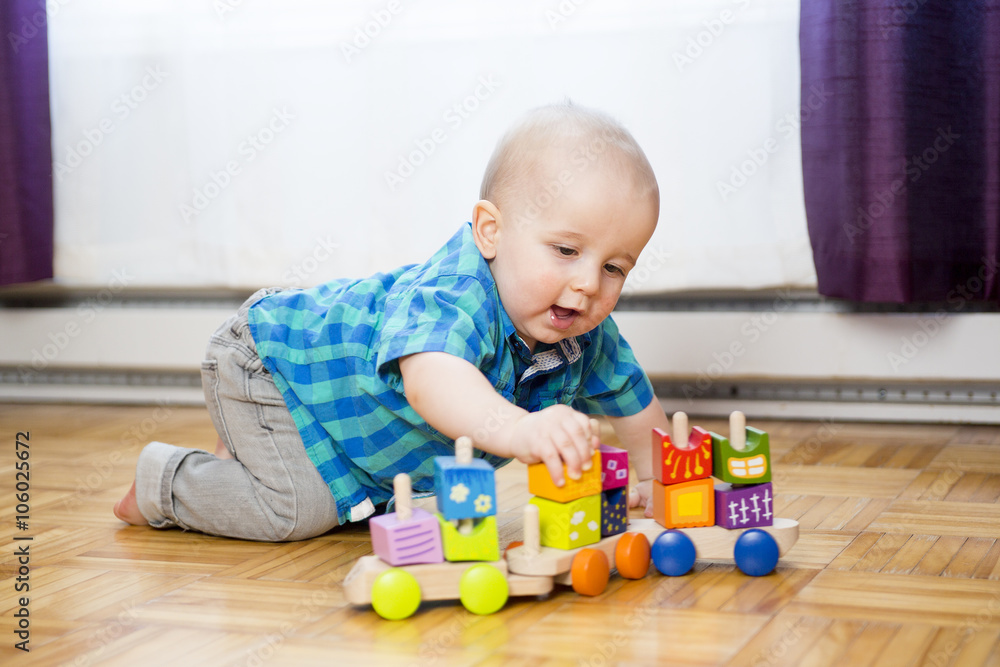 kid toddler playing wooden toys at home or nursery kid toddler playing wooden toys at home or nursery