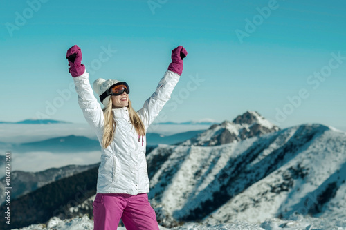 Female stay on the top of mountain with beautiful view
