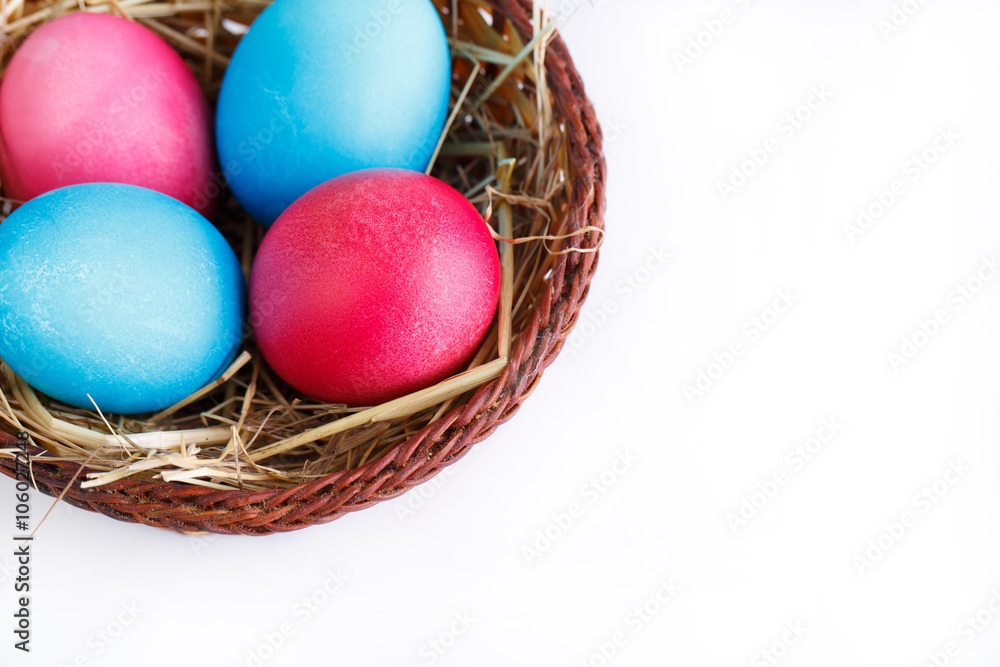 Painted eggs in basket isolated on white background. Painted eggs in basket isolated on white background.