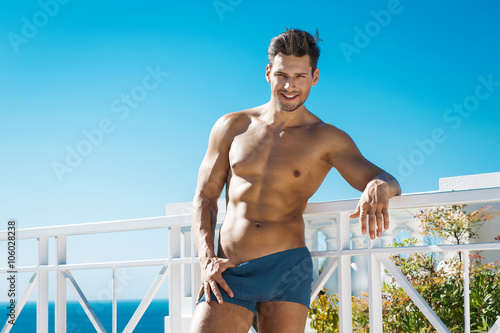 Sexy man wearig swimming trunks