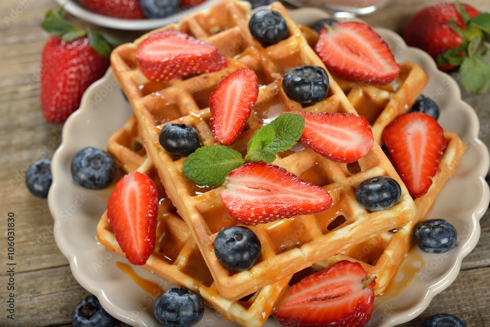 Waffles with berries and caramel sauce Waffles with berries and caramel sauce