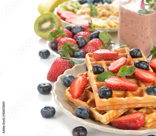 Waffles with berries and caramel sauce