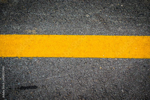 Asphalt with yellow road line © golfloiloi