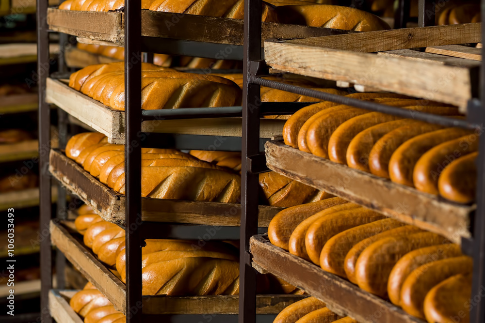 Bread stacked on the shelves. 