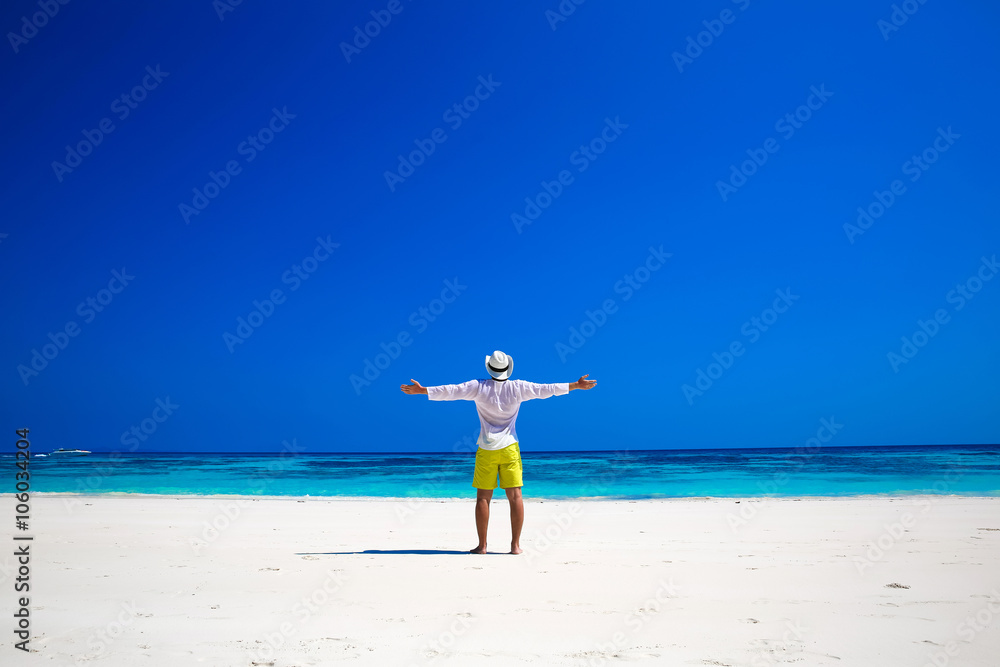 Nature. Seashore. Happy free Man Raising His Hands or Open arms