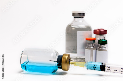 Vaccine in vial with syringe on a white background. Close up.
