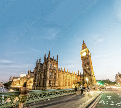 Westminster Palace at night with city traffic, London - UK