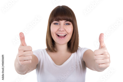 happy young beautiful plus size woman thumbs up isolated on whit © Di Studio