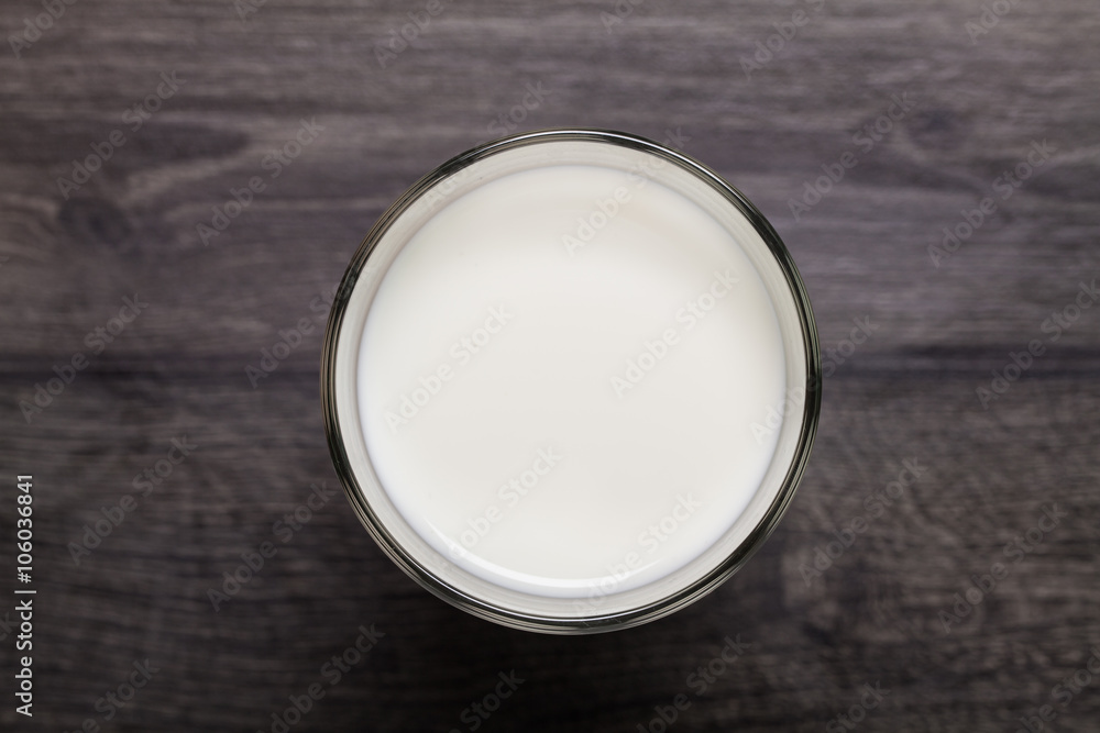 Glass of milk on wooden table Glass of milk on wooden table