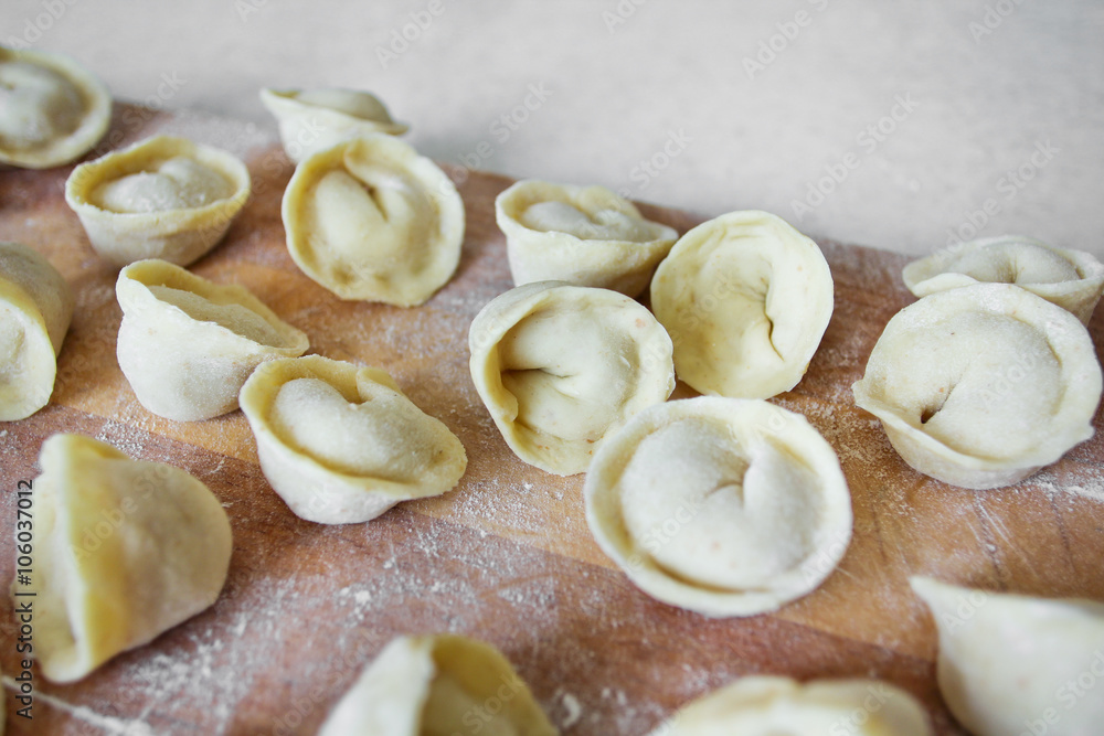 Uncooked dumplings (Pelmeni). Traditional Russian dish Uncooked dumplings (Pelmeni). Traditional Russian dish