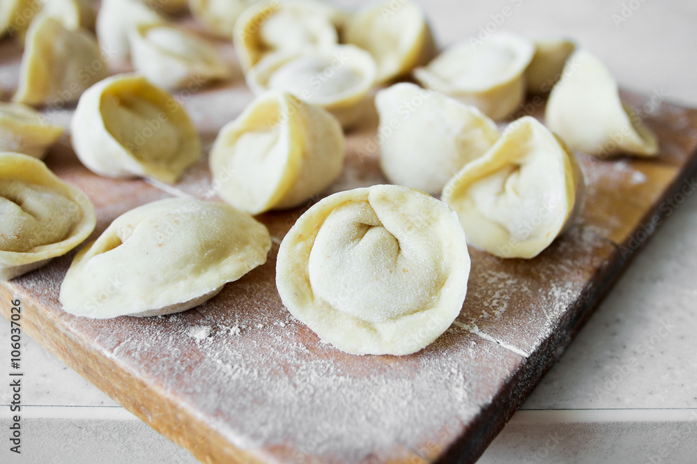 Uncooked dumplings (Pelmeni). Traditional Russian dish Uncooked dumplings (Pelmeni). Traditional Russian dish