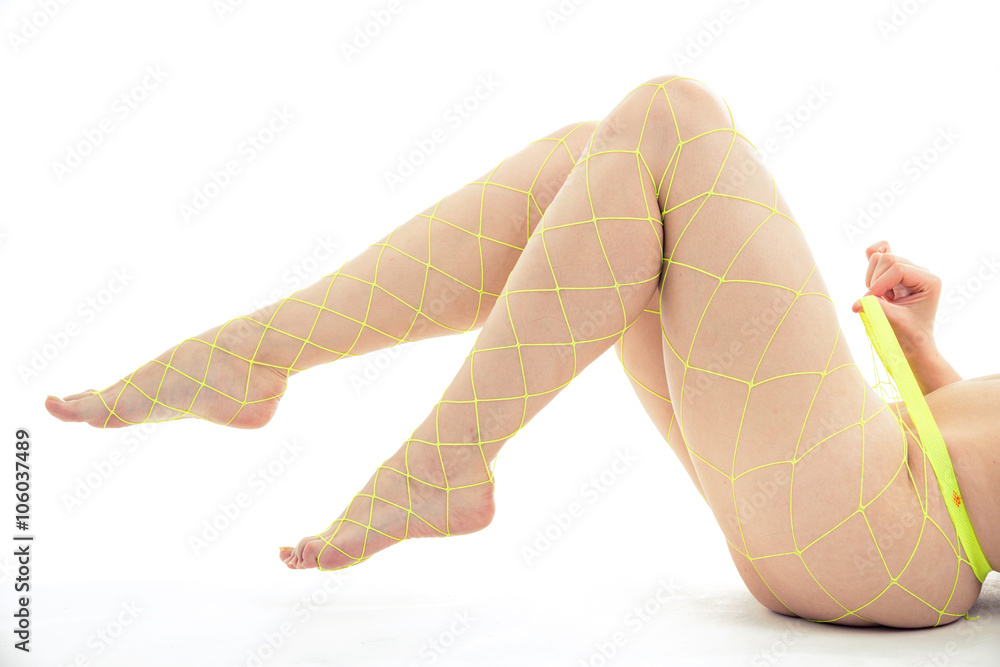 Naklejka premium Naked woman yellow stockings on white