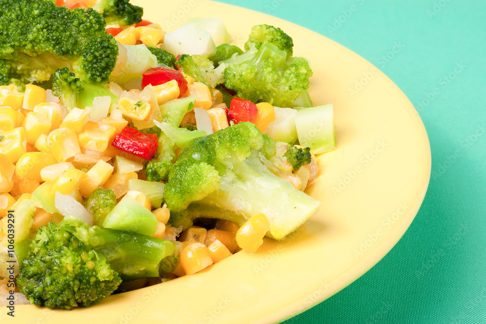 raw vegetable mix on the yellow plate