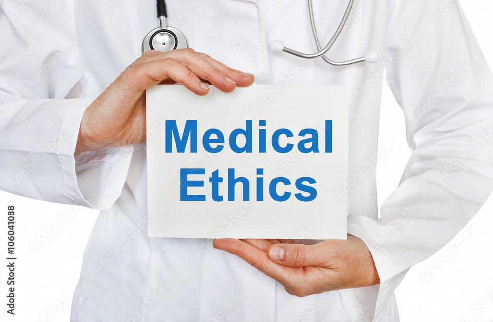 Medical Ethics card in hands of Medical Doctor Medical Ethics card in hands of Medical Doctor