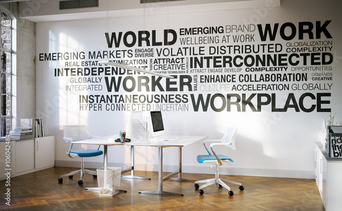 Arbeitsplatz vor Wand mit wortwolke - business keywords cloud in front of a desk photo