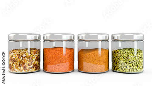 Set of spices in glass bottles, isolated on white background