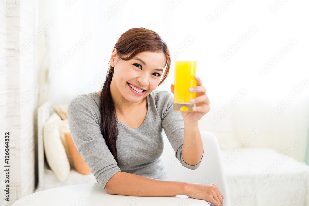 Young Woman having orange juice Young Woman having orange juice