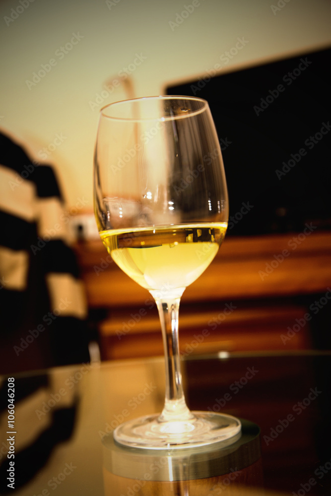 glass of white wine on a table