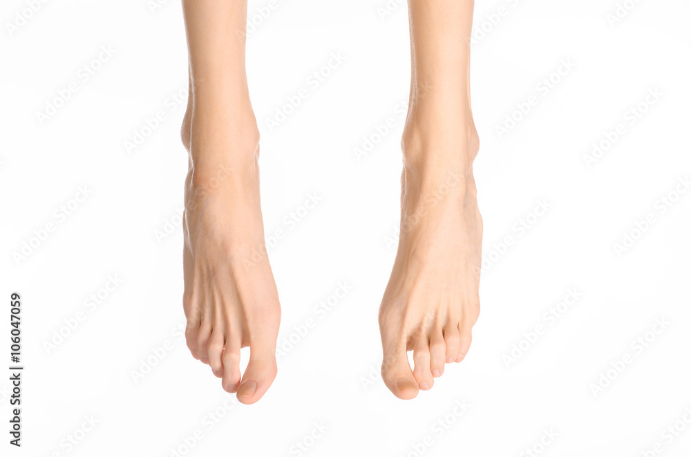 Pedicure and foot care topic: the naked man's legs isolated on white background in studio Pedicure and foot care topic: the naked man's legs isolated on white background in studio
