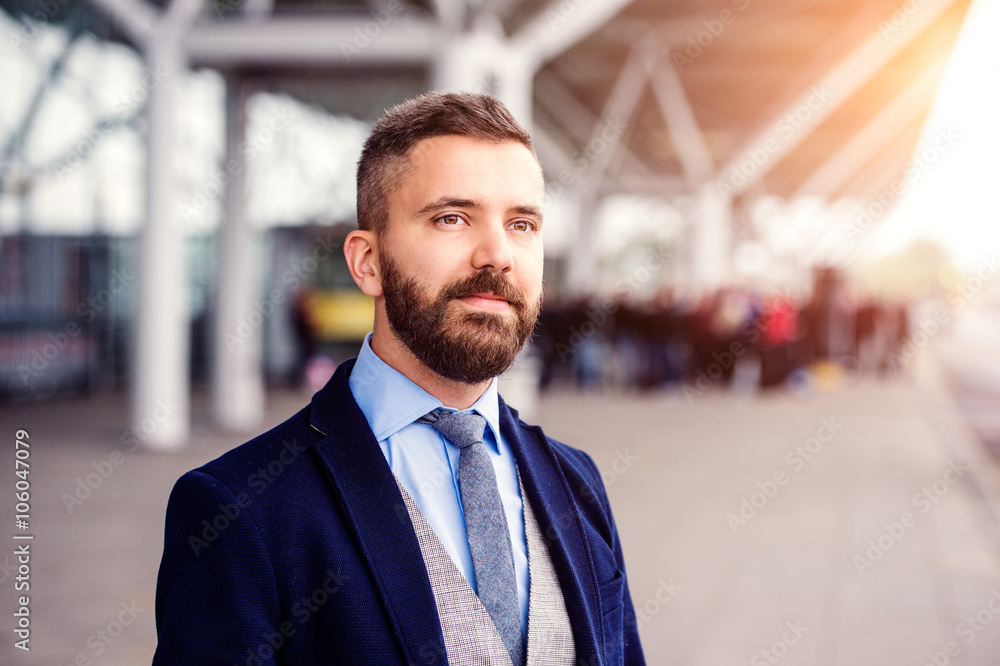 Hipster businessman in suit waiting at the airport Hipster businessman in suit waiting at the airport