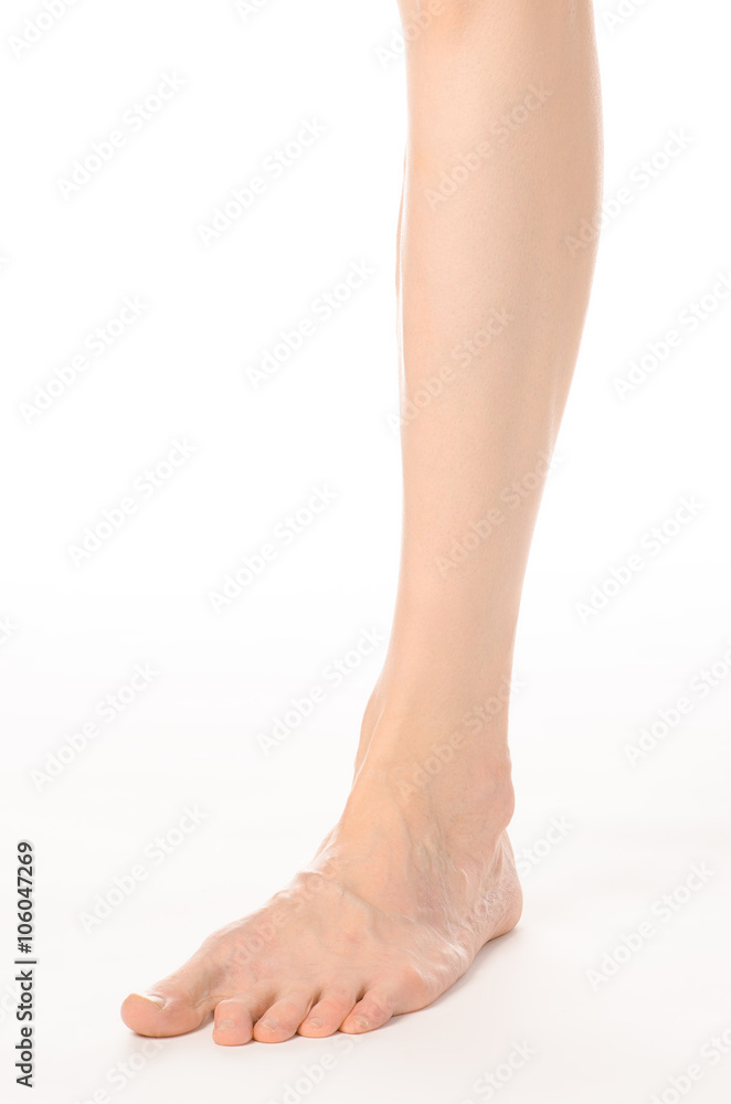 Pedicure and foot care topic: the naked man's legs isolated on white background in studio Pedicure and foot care topic: the naked man's legs isolated on white background in studio