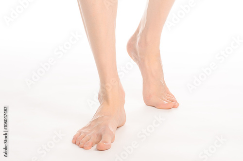Pedicure and foot care topic  the naked man s legs isolated on white background in studio
