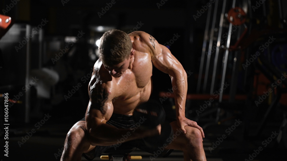 excellent result. handsome young man doing exercises for the biceps. excellent result. handsome young man doing exercises for the biceps.