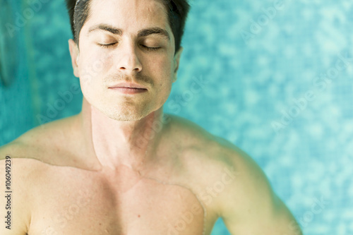 Man floating in the pool © BGStock72