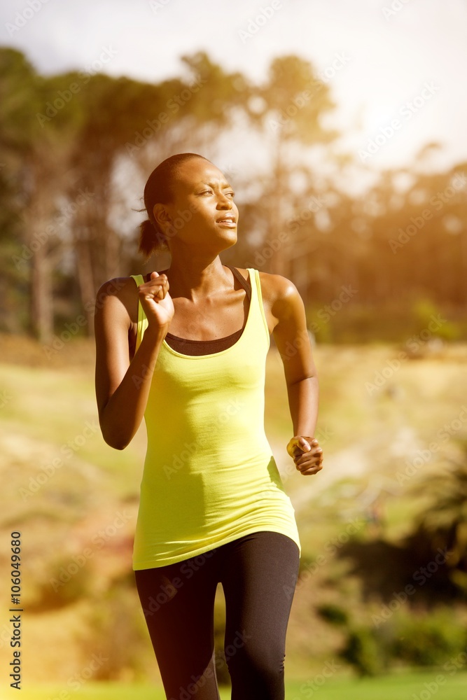 Happy young woman exercising in park Happy young woman exercising in park