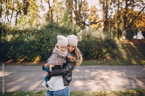 young family walking in the park