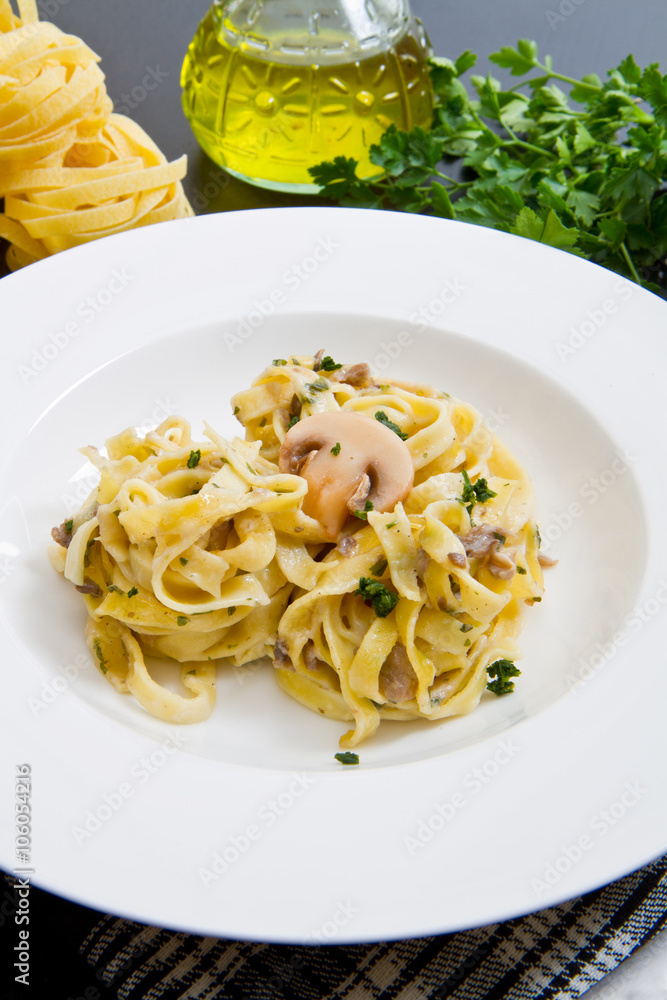 tagliatelle and mushrooms with fresh ingredients