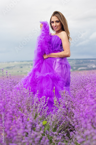 Woman is wearing fashion dress at lavender flowers