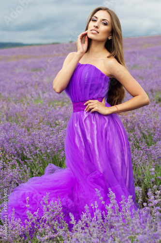 Girl is wearing fashion dress at lavender flowers