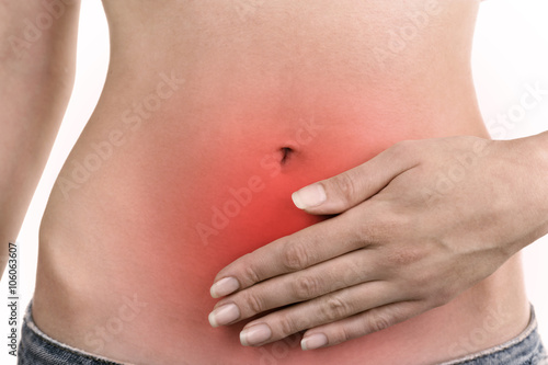 Young girl with abdominal pain close up