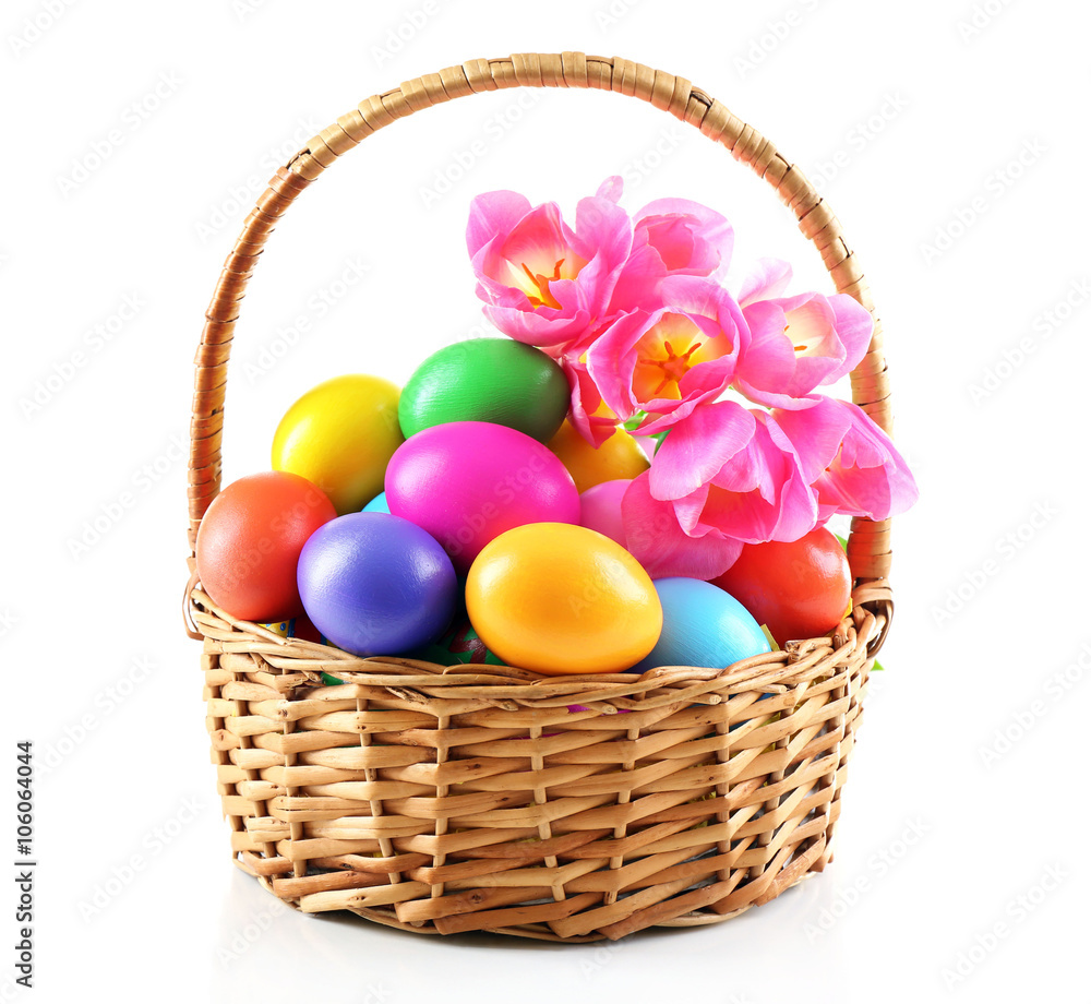 Multicoloured Easter eggs in basket isolated on white
