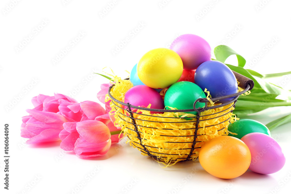 Multicoloured Easter eggs and tulips isolated on white Multicoloured Easter eggs and tulips isolated on white