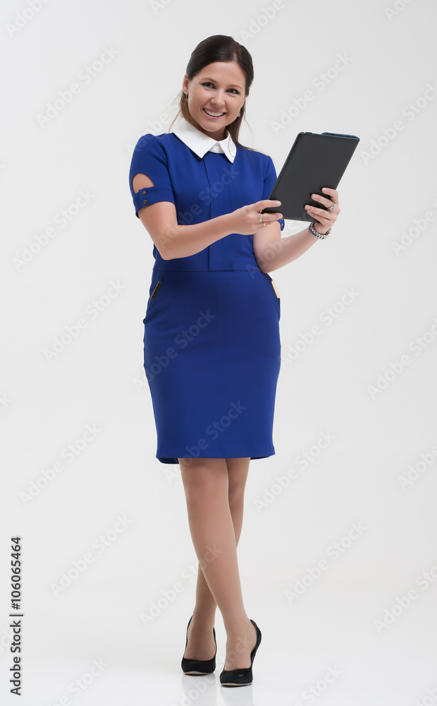 Girl in a blue suit. Keep a folder in his hands. Girl in a blue suit. Keep a folder in his hands.